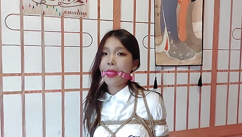 Sexy blonde porn scene with a toy in her mouth